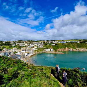 shoreline of South Wales, houses leading to the water's edge, author and family on the shore